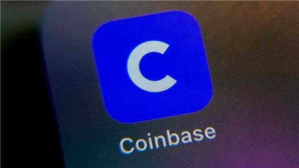 Das Logo der Coinbase-App ist auf dem Bildschirm eines Handys zu sehen.