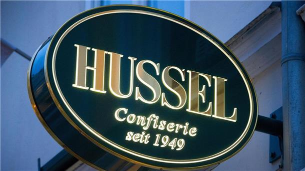 Viba übernimmt Hussel-, Arko- und Eilles-Filialen Das Logo der Confiserie „Hussel“.