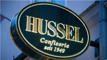 Das Logo der Confiserie „Hussel“.