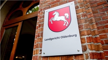 Schild an einer Mauer