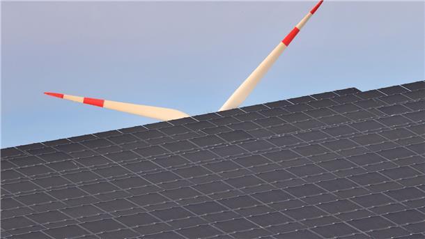 Ein Windrad dreht sich hinter Solarzellen eines Solarparks. Wie Kommunen sich künftig klimaschonend aufstellen können, beschäftigt auch den Tarmstedter Samtgemeinderat. Auf die Hilfe eines Klimaschutzmanagers will man vorerst noch verzichten.