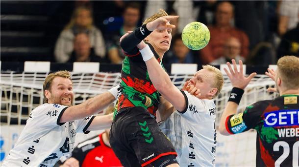 Magdeburgs Gisli Kristjansson wird von der Kieler Abwehr gestoppt.