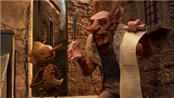Pinocchio und Count Volpe in einer Szene aus „Pinocchio“. Der Stop-Motion-Film des mexikanischen Erfolgsregisseurs del Toro ist auf der Streamingplattform Netflix zu sehen.