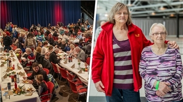 Mehrere Tischreihen mit Menschen. Und ein Bild von zwei Frauen. 