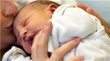 Frau mit Baby